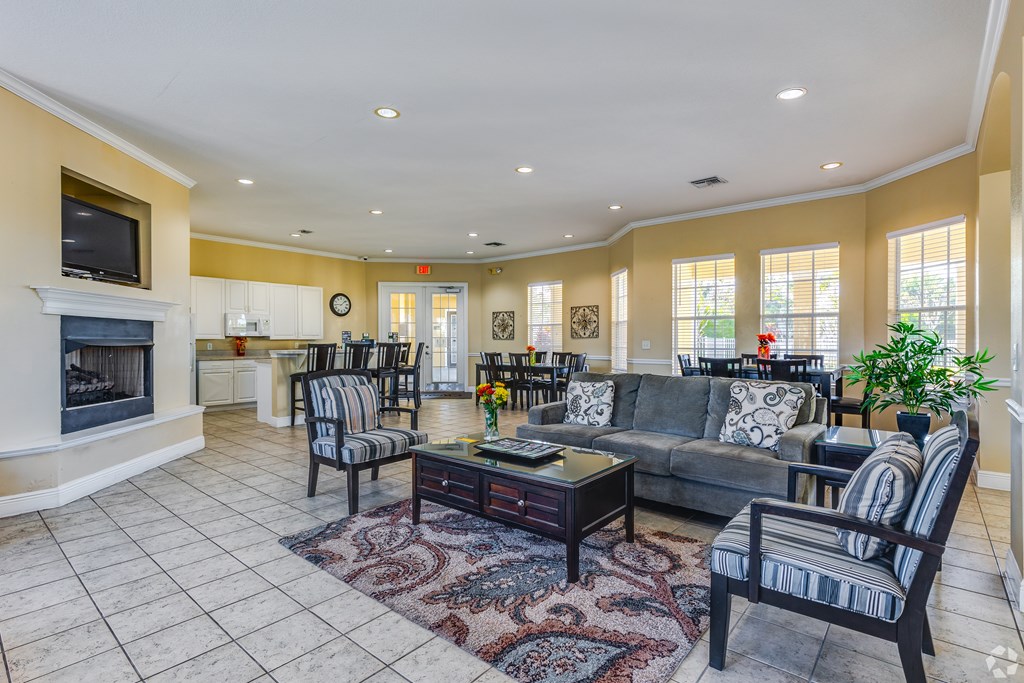 A living room with a fireplace and a couch.