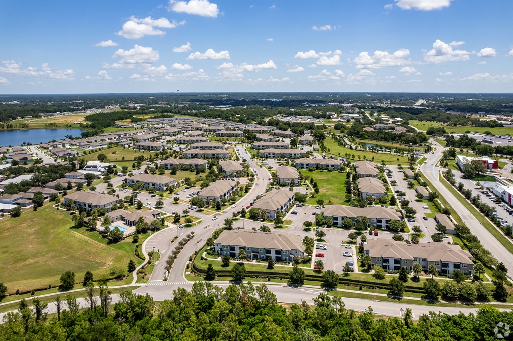 A bird's eye view of a residential area with houses and roads.