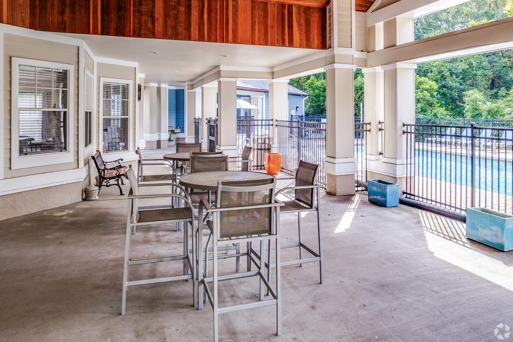 A patio with a table and chairs is shown.