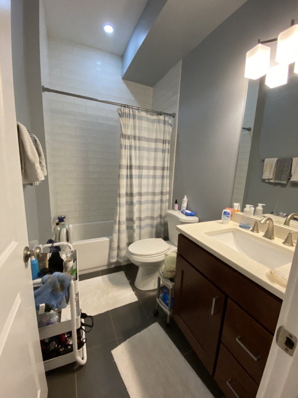 a small bathroom with a sink toilet and shower