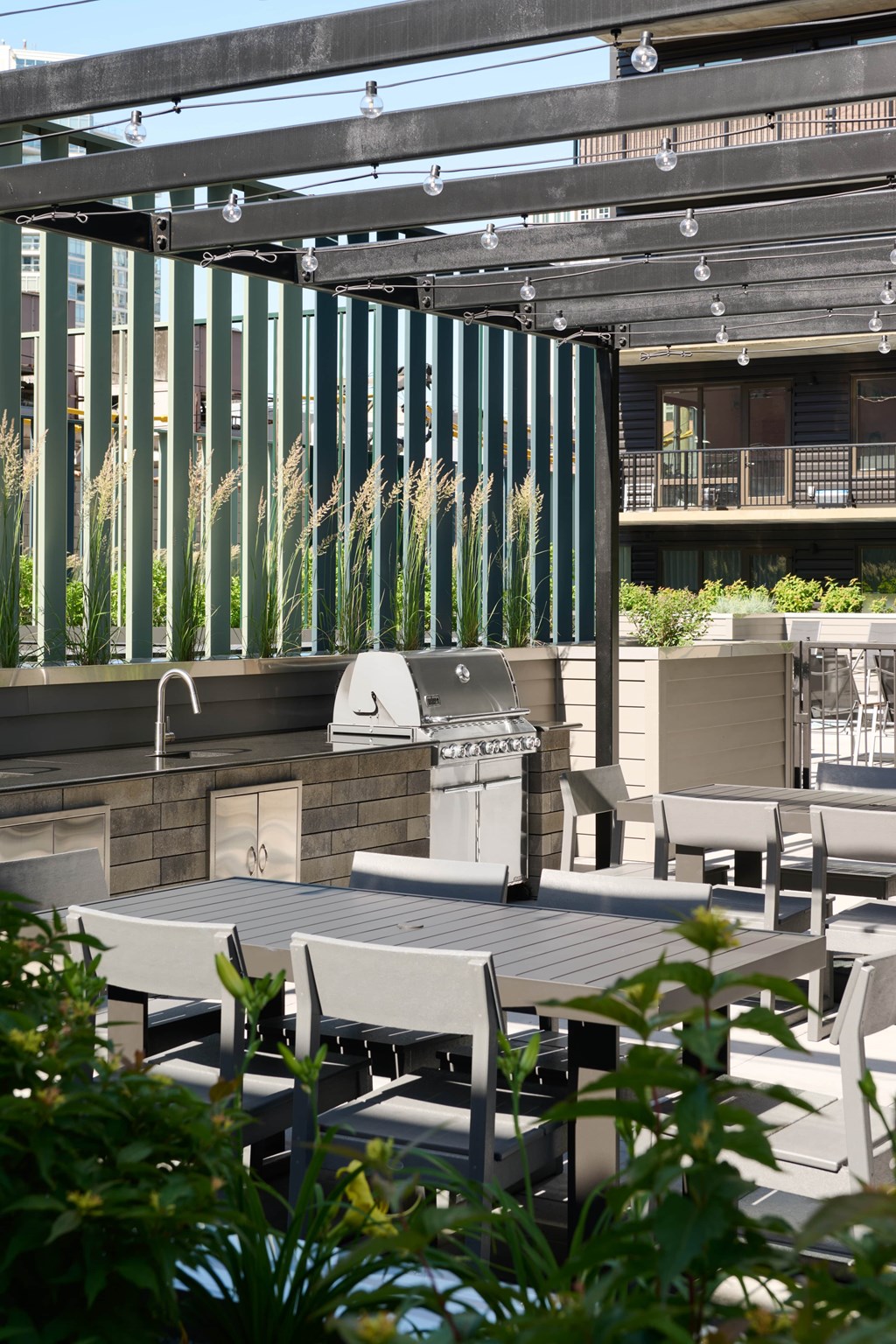 A patio with a table and chairs under a roof.