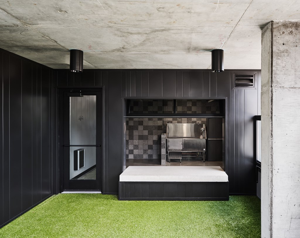 A modern kitchen with a black and white checkered backsplash.