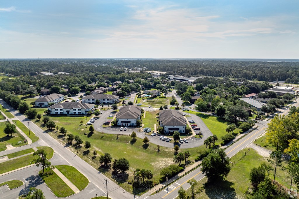 A bird's eye view of a residential area with houses and streets.