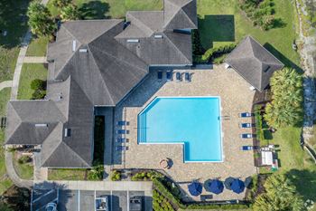 A large house with a pool in the backyard.
