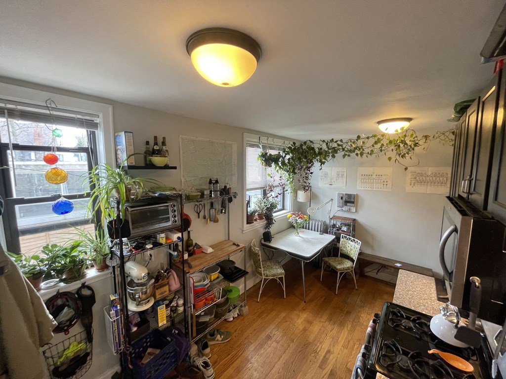 A small kitchen with a table and chairs.