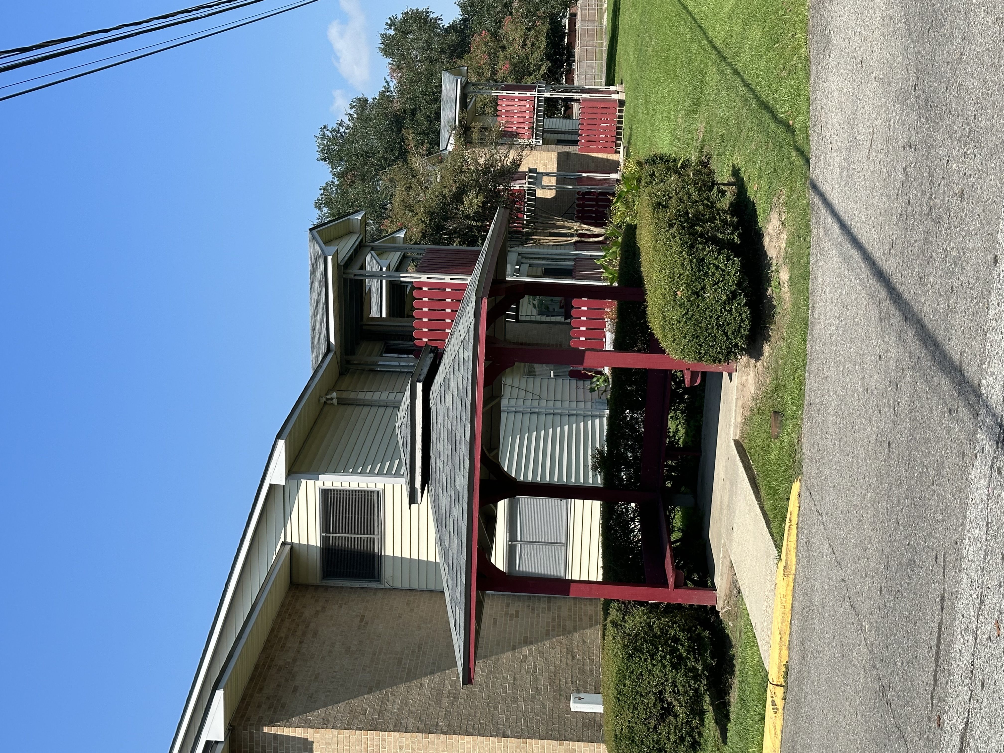 a view from the top of the building looking down on the roof