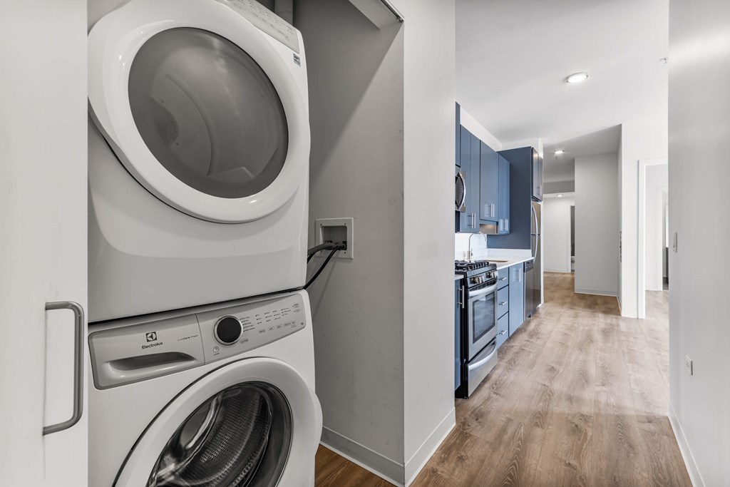 A white washer and dryer in a laundry room.