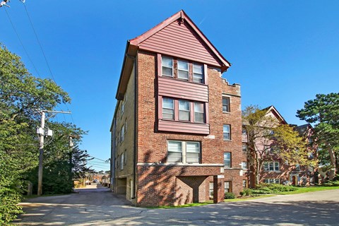 an old brick apartment building on a city street