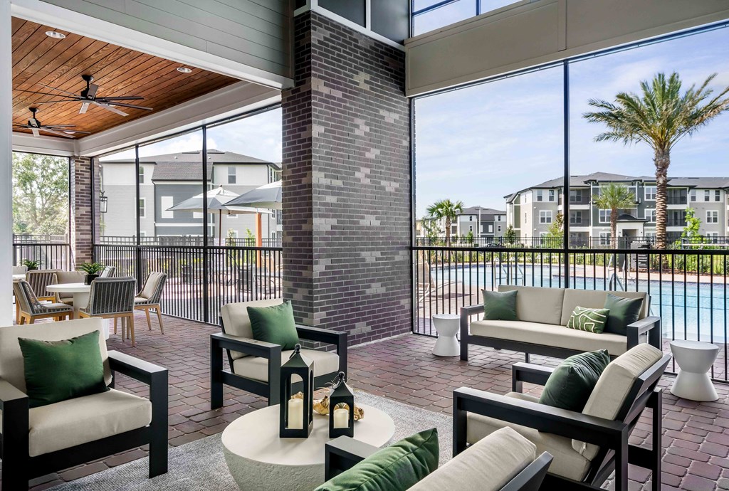 A patio with a pool and a view of apartment buildings.