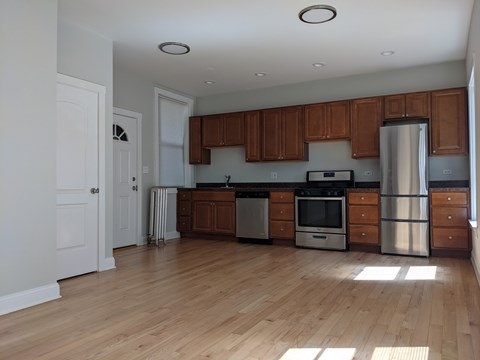 A kitchen with wooden cabinets and stainless steel appliances.