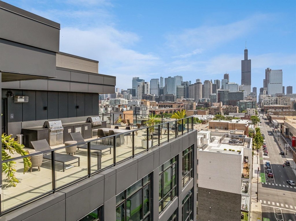 the view of the city from the rooftop deck of a building