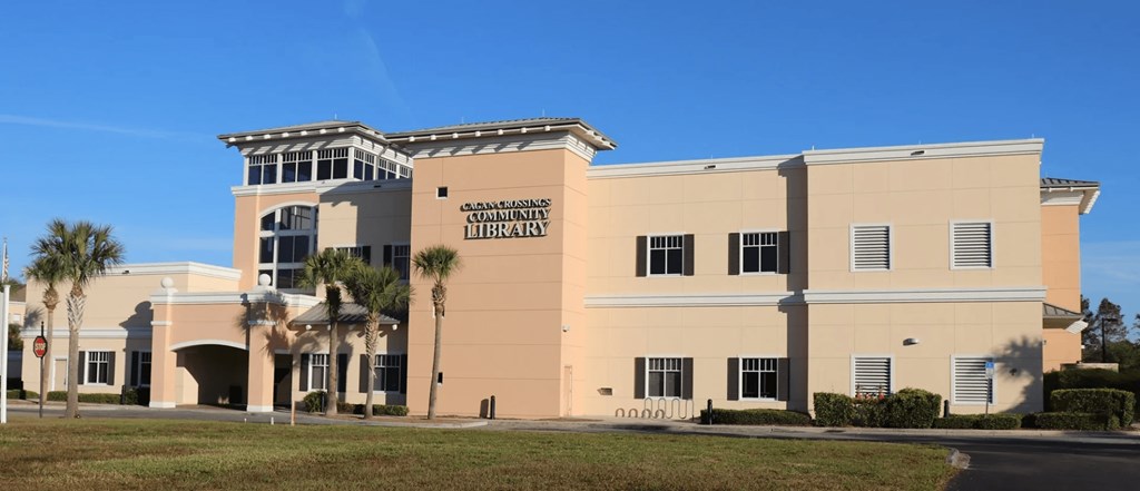 A library building with a sign on the front.