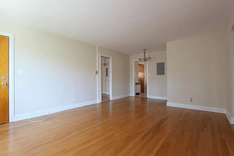 A room with wooden floors and white walls.