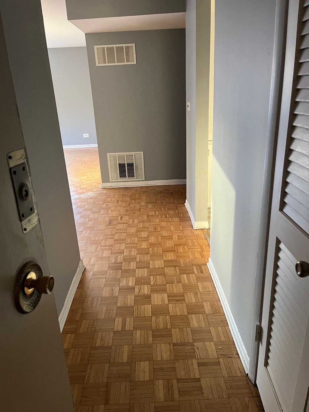 a view from the front door of a house with a wood floor