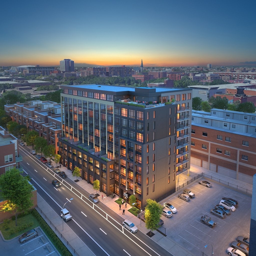an aerial view of a building on a city street