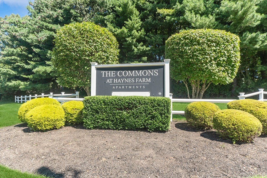 Monument Sign and Front Entrance at The Commons at Haynes Farm Apartments in Boston, MA.