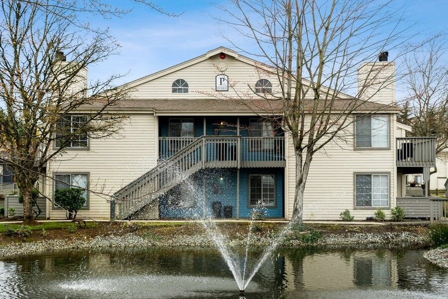 Exterior view of apartments near lake with fountain