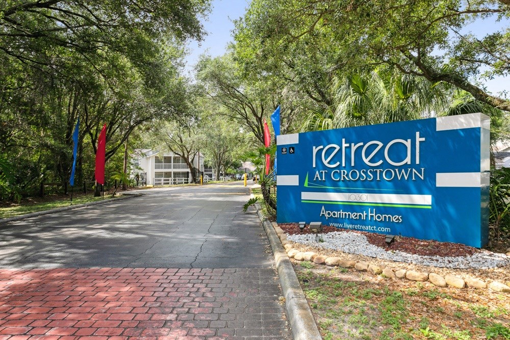 Retreat at Crosstown Apartments sign at entry
