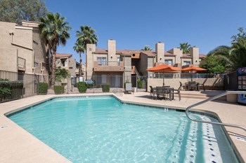 Swimming pool with view of apartments in background - Photo Gallery 6