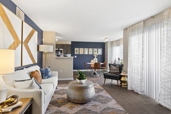 Model living, dining, & kitchen spaces