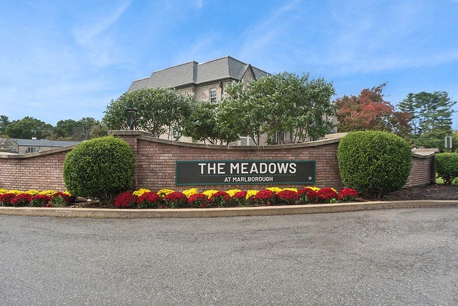 Community Monument Sign and Landscape at Meadows at Marlborough Apartments located in Marlborough, MA.