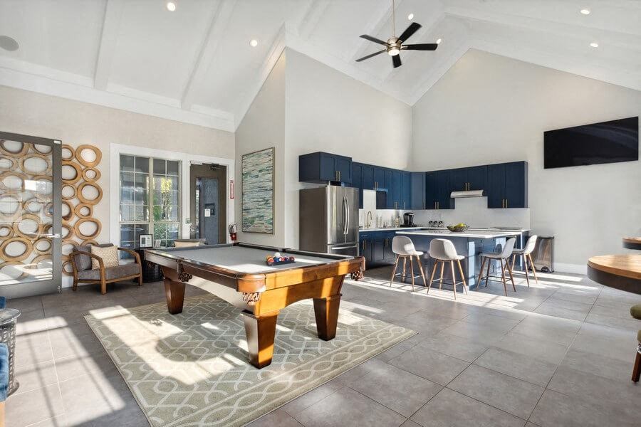 Clubhouse Pool Table and Kitchen at Caribbean Breeze Apartments in Tampa, FL.