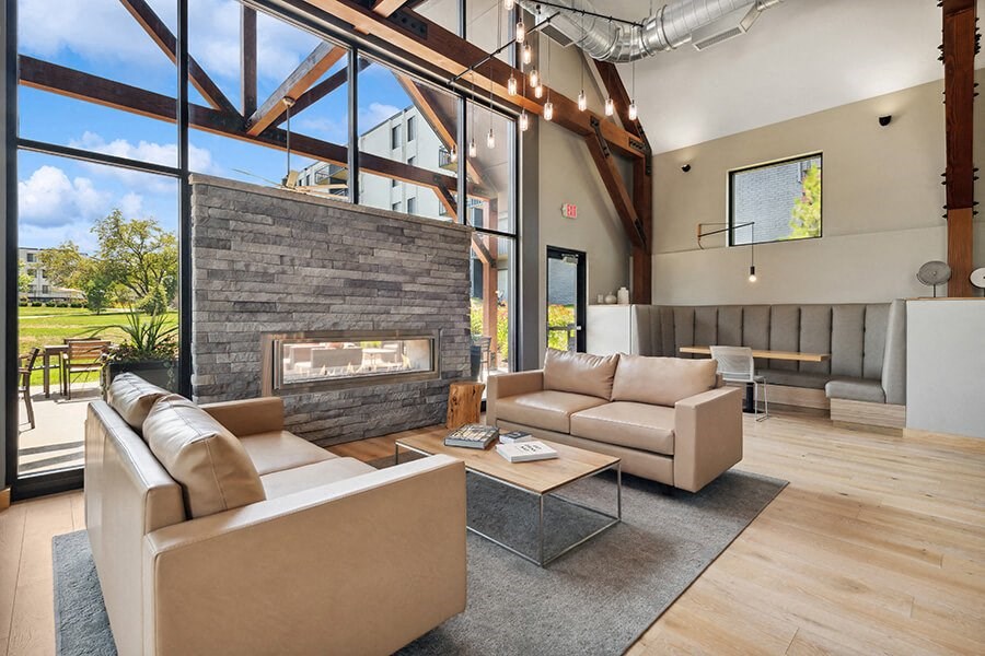 Community Clubhouse with Lounge Furniture and Fireplace at Elevate on Parkway Apartments, Burnsville