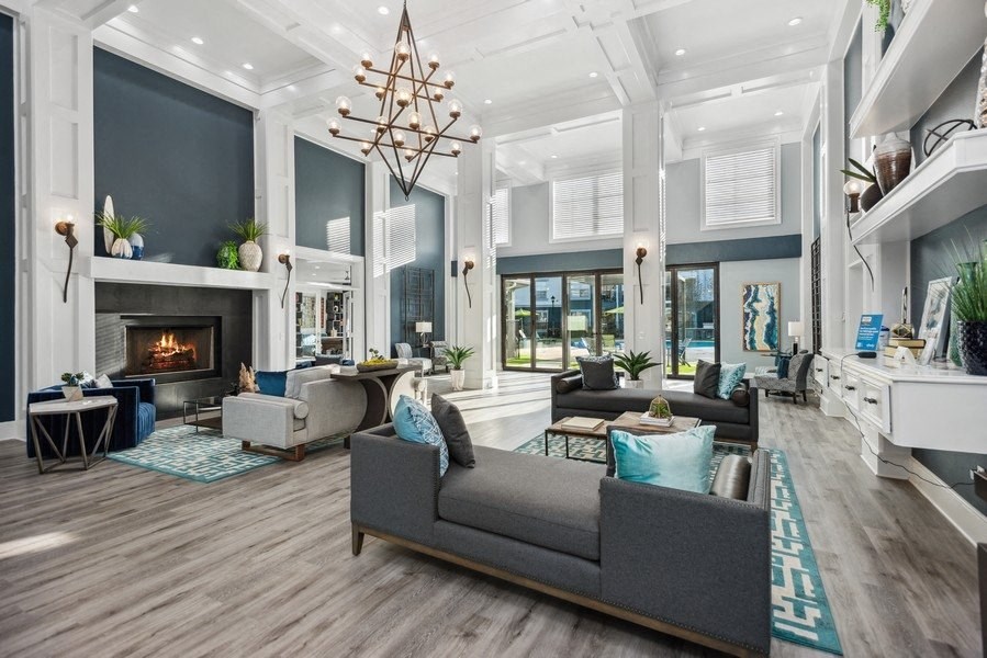 Community lounge with fireplace at Park West Apartments in Houston, Texas