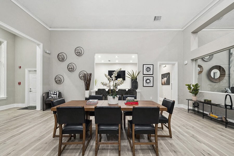 Community Clubhouse with Lounge Furniture at Bridges at Oakbend Apartments located in Lewisville, TX.