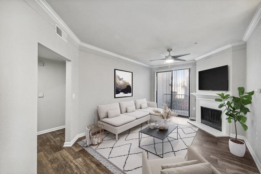 Model living room and patio door at Bridges at Oakbend, Lewisvillle, Texas