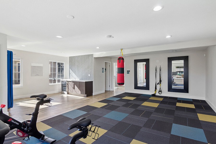 Community Fitness Center with Equipment at Los Gatos Landing Apartments located in San Jose, CA.
