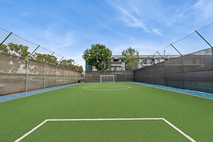Community Soccer Field with Nets at Madison Park Apartments located in Anaheim, CA.