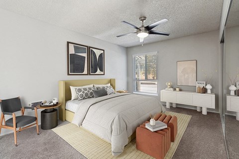 1-Bedroom Apartments in El Cajon, CA - Colonnade at Fletcher Hills - Spacious Bedroom with Ceiling Fan and Carpeting, Upholstered Headboard, Neutral Bedding, Window Blinds, and Mirrored Closet Doors.