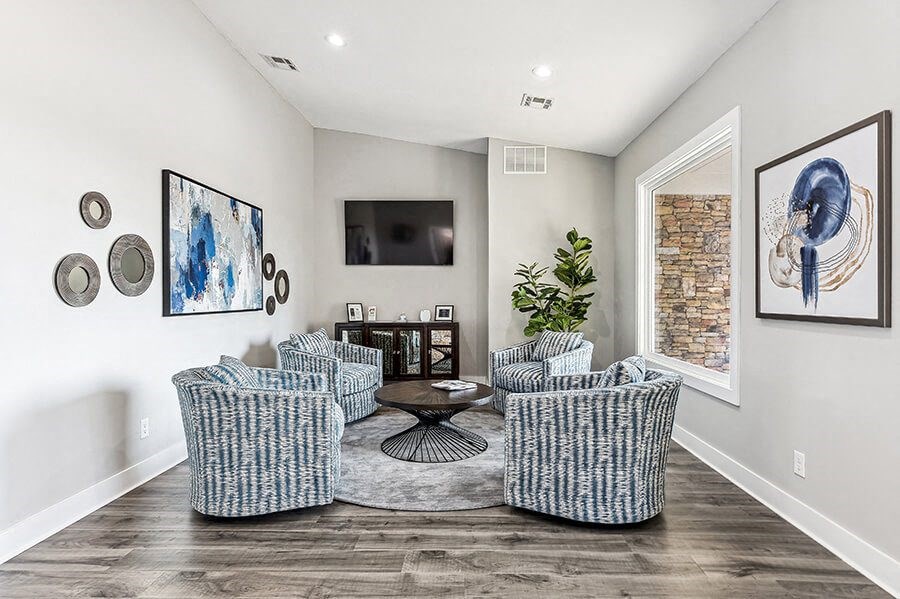 Community Clubhouse with Lounge Furniture and Coffee Bar at Paramont Apartments in Duluth, GA.