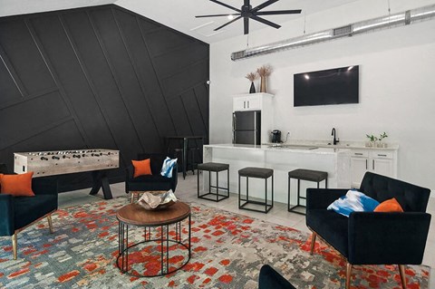 Community Clubhouse with Lounge Furniture, Game Tables & Kitchenette at Overlook Apartments located in Salt Lake City, UT.