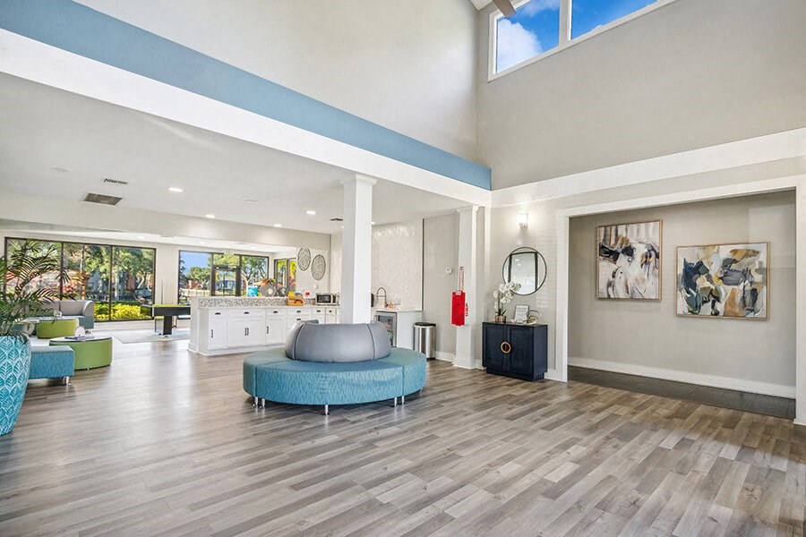 Community Clubhouse with Lounge Furniture at Bridges at Bayside Apartments in St. Petersburg, FL.