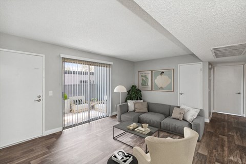 Model living room of an apartment with a couch and a coffee table