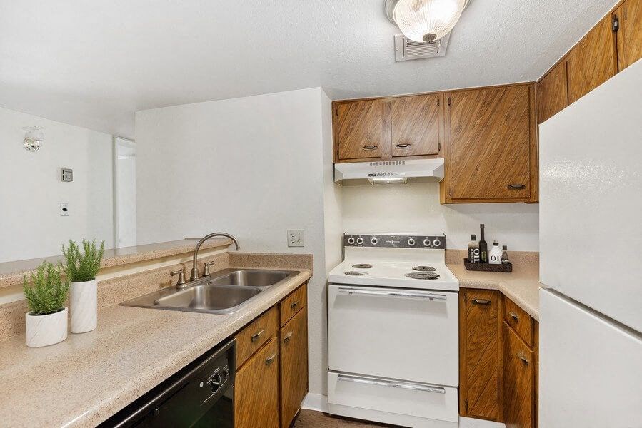 Model kitchen with dishwasher, range, and refrigerator