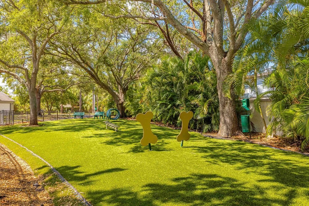 Dog park with agility equipment at Huntington Place Apartments in Sarasota, Florida