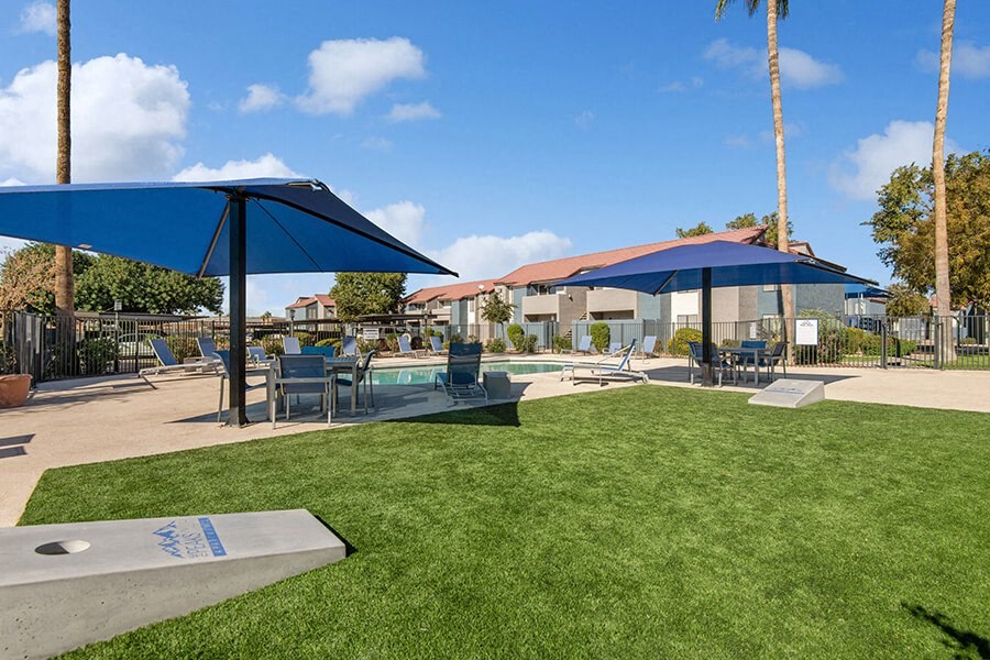 Outdoor Corn Hole Area at Peaks on 4th Apartments in Avondale, AZ.