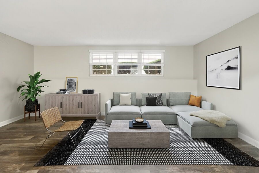 Model Living Room with Wood-Style Flooring at Meadows at Marlborough Apartments located in Marlborough, MA.
