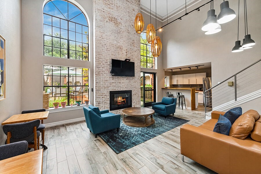 Community Clubhouse with Lounge Furniture and Kitchenette Area at Dallas North Park Apartments in Dallas, TX.