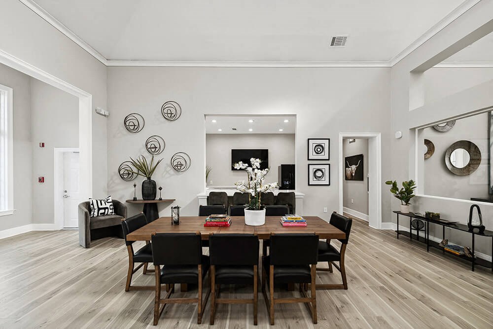 Community Clubhouse with Lounge Furniture at Bridges at Oakbend Apartments in Lewisville, TX.