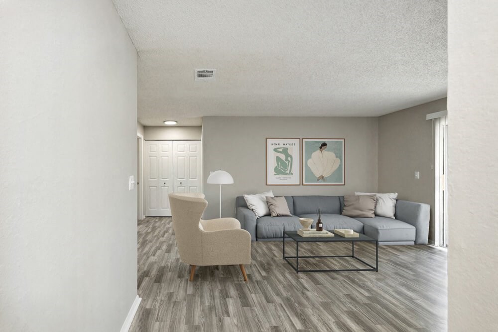 Model living room with chairs and sofa