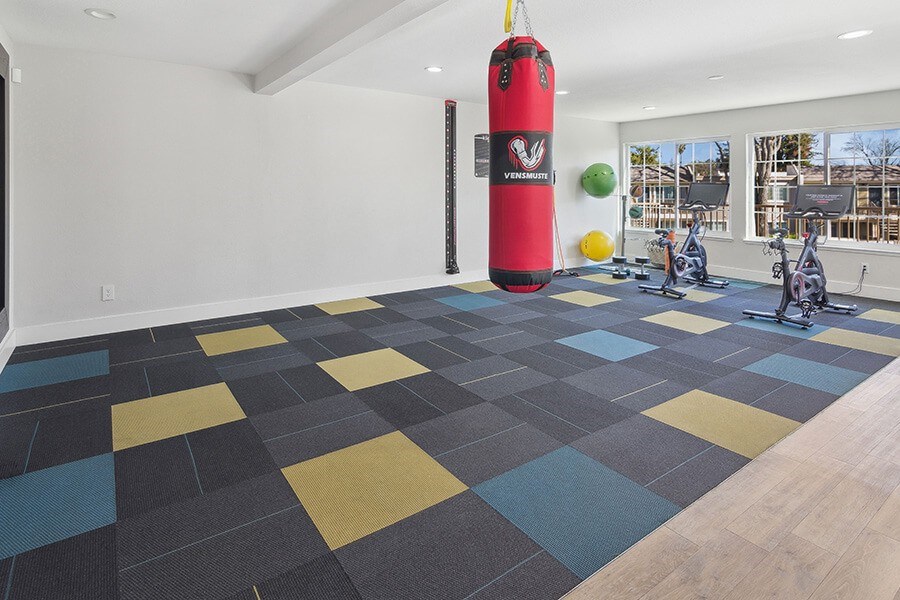 Community Fitness Center with Equipment at Los Gatos Landing Apartments located in San Jose, CA.