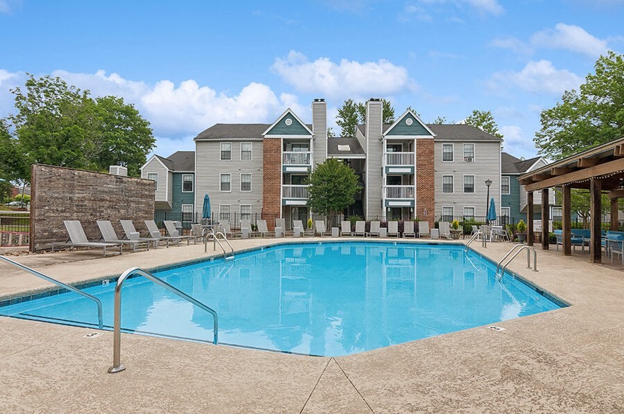 Community Swimming Pool with Pool Furniture at Park 2300 Apartments in Charlotte, NC.