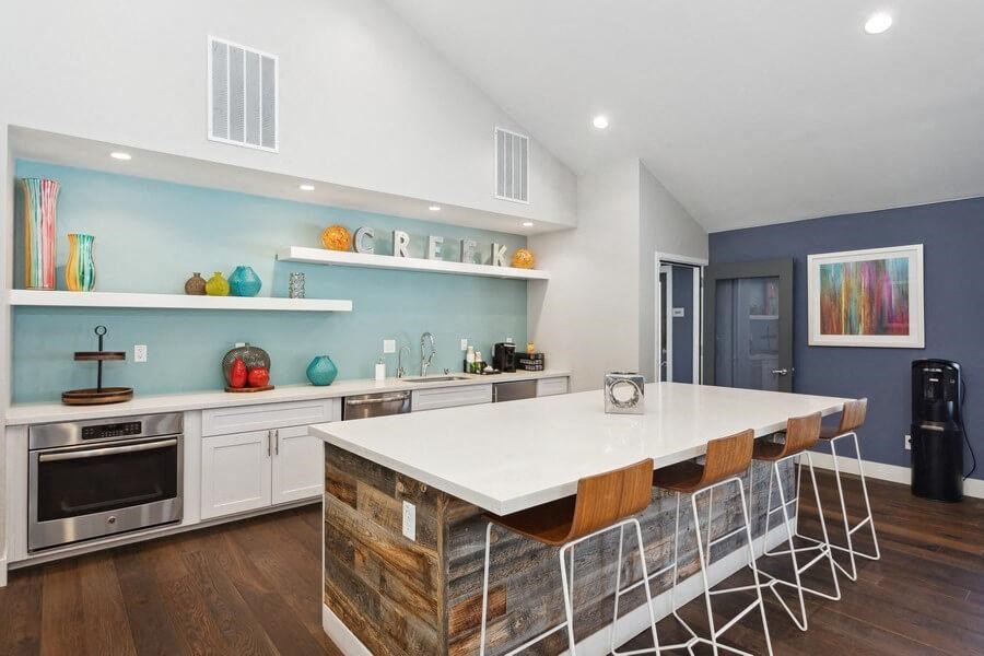 Community Clubhouse with Kitchen Area and Island at Creek 2645 Apartments in Sacramento, CA.