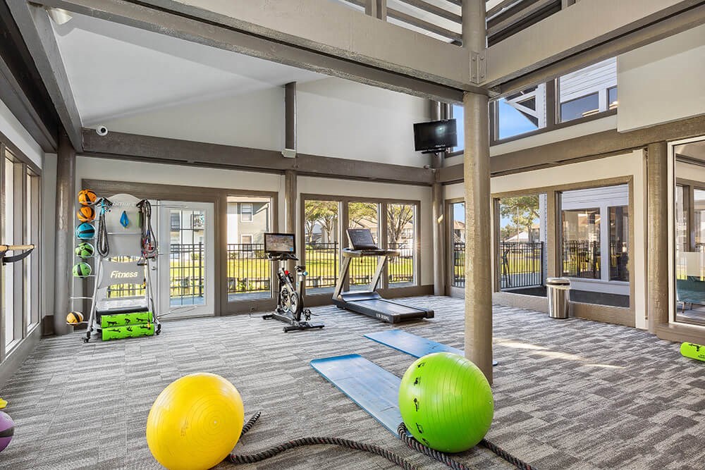 Community Fitness Center with Equipment at Seven Lakes at Carrollwood Apartments in Tampa, FL.
