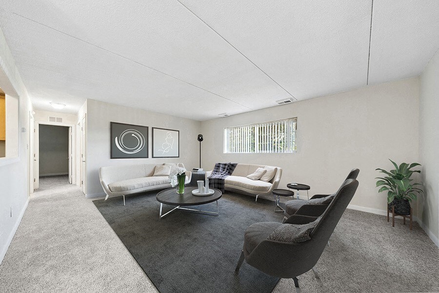Model Living Room with Carpet and Hallway View at Heights Marlborough Apartments in Boston, MA.