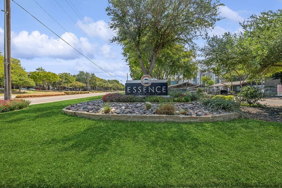 Monument Sign and Front Entrance at Essence Apartments in Dallas, TX.